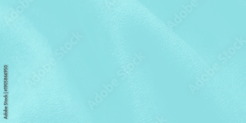 Frozen liquid ripples and blue frost textures create a cold nature pattern as water flowing from the fountain meets the light on a winter ice surface backdrop