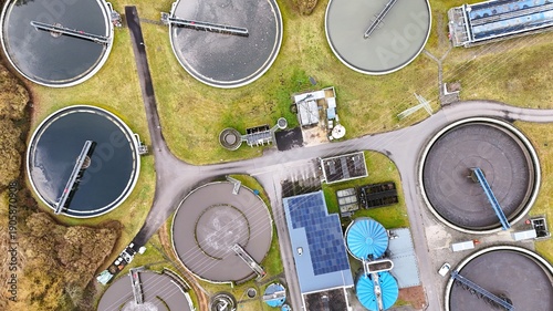 Aerial View of Modern Wastewater Treatment Plant with Circular Clarifiers	
