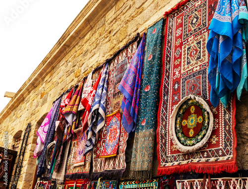 Antique shop in Icherisheher, in the old city of Baku. Antique carpets, pillows, women's shawls, bags, handmade dishes made of iron and copper, various souvenirs are on sale. Souvenirs in the Old City