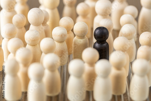 Photos A single black figure among white ones
