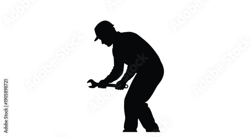 Silhouette of a mechanic working with a wrench against a white background