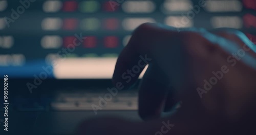 Scrolling through stock market prices on laptop