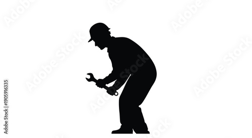 Silhouette of a mechanic working with a wrench against a white background