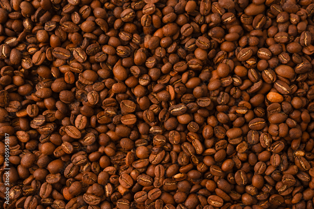 Fototapeta premium Coffee beans on a white background. Coffee beans texture.