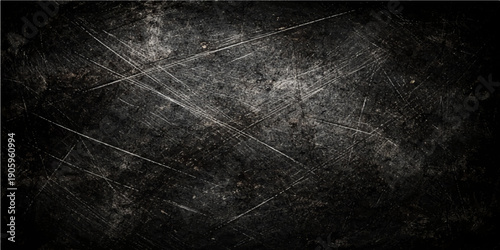 Aged dark grunge texture with a vintage black and white pattern on an empty dirty concrete wall surface creates a blank chalkboard backdrop for design