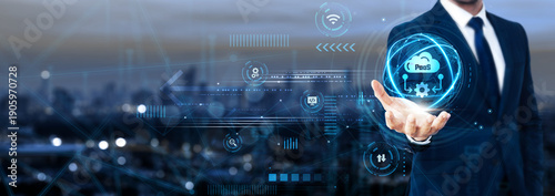 Businessman holding global Paas network and cloud platform solutions, scalable infrastructure, application deployment, enterprise software, cloud integration, SaaS management, IT optimization