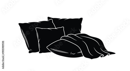 Black pillows and folded blanket displayed in a stark silhouette