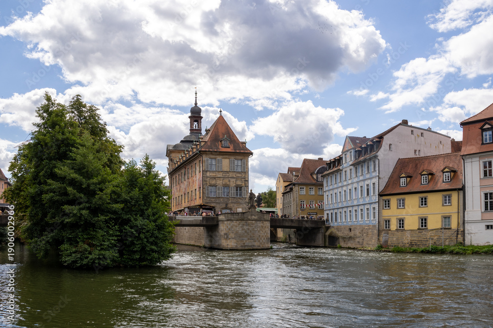 Fototapeta premium Altes Rathaus in Bamberg, Bavaria, Germany, iconic old town hall on an artificial island in the Regnitz River, connected by pedestrian bridges including Untere Brücke, featuring porcelain museum 
