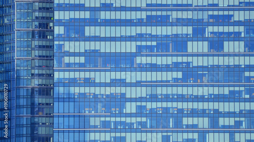 Modern office building with glass facade background. Transparent glass wall of office building.