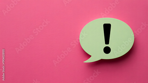 Green speech bubble with exclamation mark on pink background symbolizing important message or alert in a creative way for communication and notification purposes effectively.