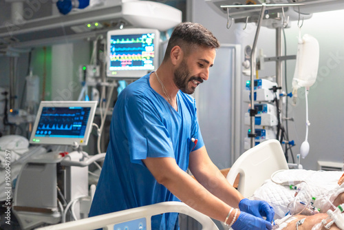 Male nurse caring patient in intensive care unit
