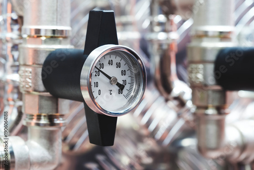 Photos Industrial water supply gas supply machine with metal pipes and pressure gauges