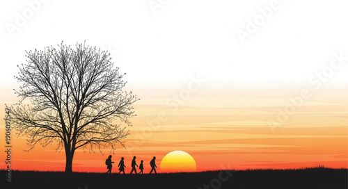 Silhouettes of people walking by a tree at sunset.