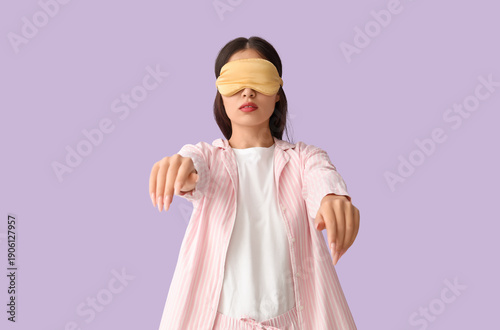 Female sleepwalker in pajam...