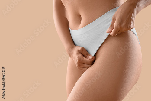 Young woman in underwear wi...