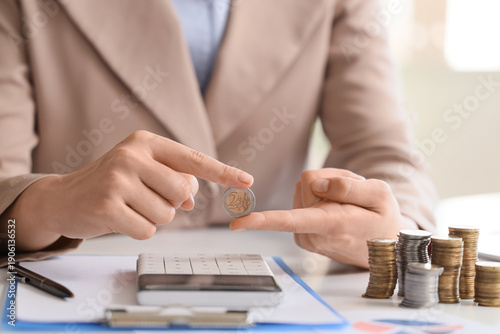 Businesswoman with coin at ...