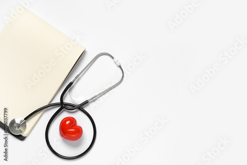 Blank notebook with stethos...