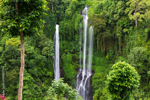 Triple waterfall, Sekumpul waterfall in Northern Bali. Surrounded by cliffs with lush vegetation from the tropical rainforest. 
