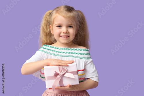 Cute little girl with gift ...