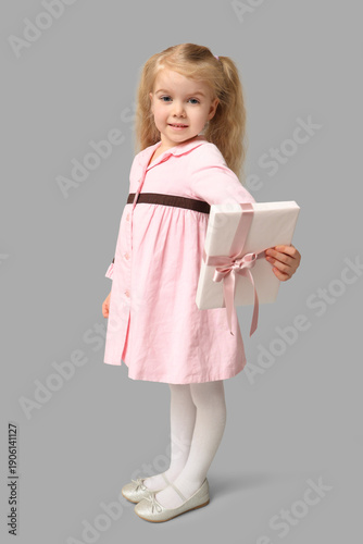 Cute little girl with gift ...