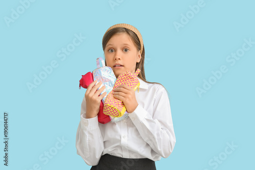 Little schoolgirl with penc...