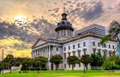 South Carolina State House in Columbia features Greek Revival architecture and a copper dome during a dramatic sunset. United States