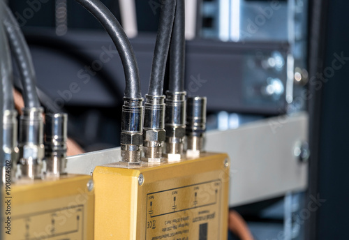 Radio frequency (RF) splitter with cables on a neutral background. Concept of electronics, signal distribution, AV setup, home or professional technology, and networking equipment.