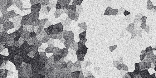 Abstract mosaic pattern of irregular gray polygons with granular texture and subtle variations in tone creating a modern, geometric, and textured background