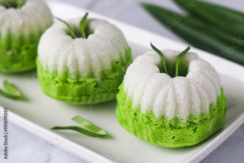 Obraz na płótnie Closeup beautiful presentation of Kue Putu Ayu, the classic Indonesian steamed pandan cake