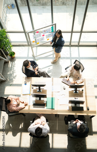 Wallpaper Mural Top view of group business leader presenting information to a team during a meeting Torontodigital.ca