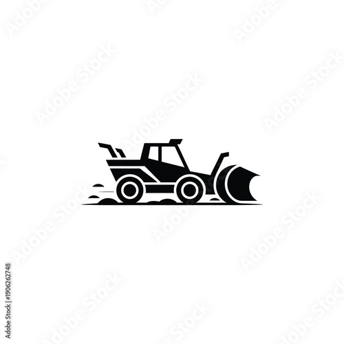 Black and white tractor with a snowplow attachment