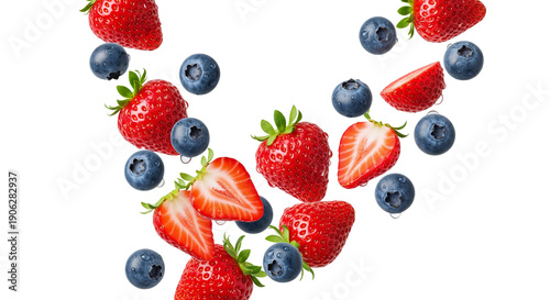 Fresh strawberry and blueberry flying in air with water drops isolated on white background. Healthy summer forest fruit explosion concept.