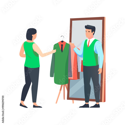 Man trying on a stylish green vest in front of a mirror in a clothing store, with a female shop assistant helping him.
