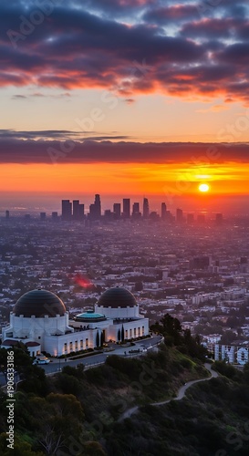 Griffith Observatory and Los Angeles skyline at sunset, a scenic view.