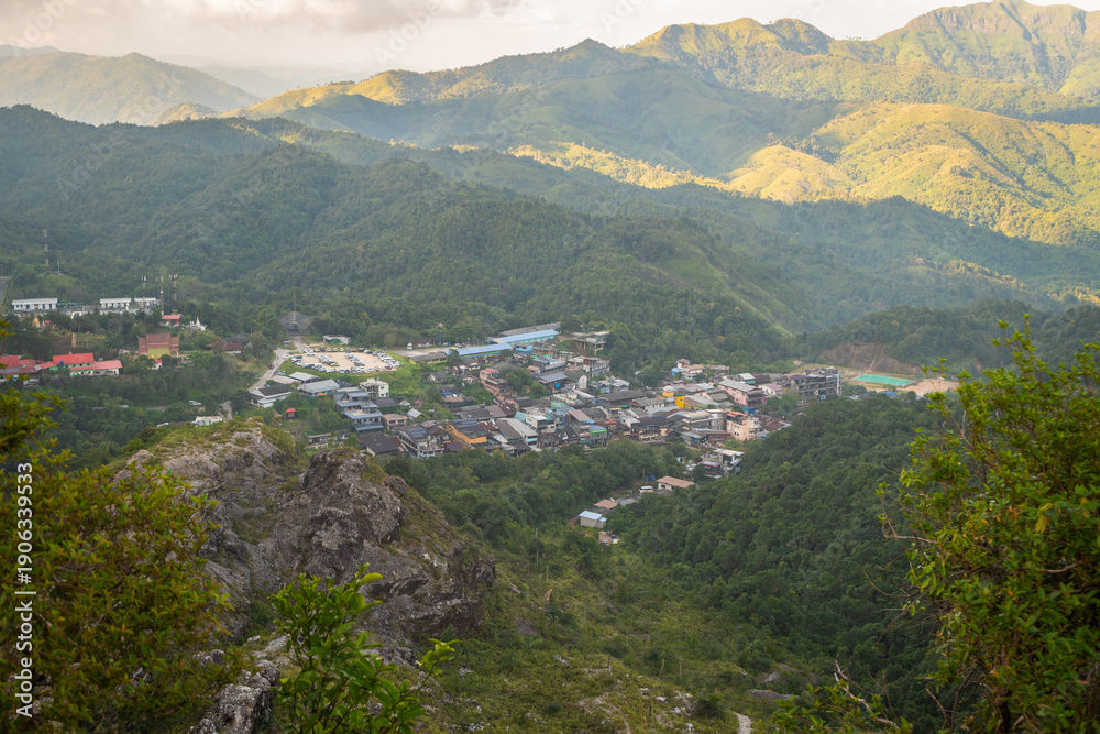 Naklejka premium Panoramic view of the peaceful Pilok village nestled in the lush valleys of Nern Chang Suek, Thong Pha Phum, Kanchanaburi, Thailand
