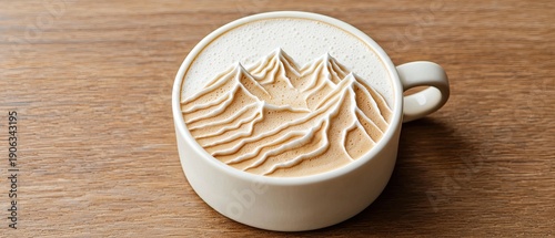 Creamy latte with detailed mountain inspired foam art served in ceramic cup on wooden table, combining coffee culture and artistic presentation.
