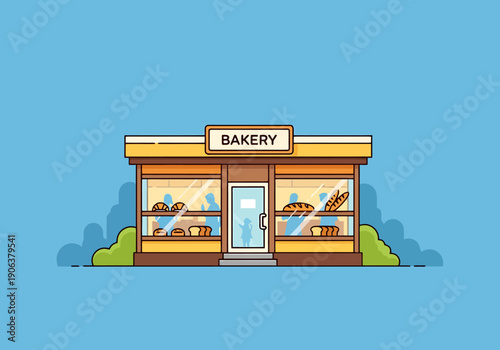 Charming bakery storefront with displayed baked goods behind large glass windows showcasing fresh bread and pastries for sale on a sunny day