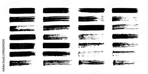 Abstract arrangement of various black brushstroke textures on white background