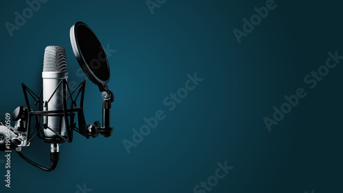Photography Podcast recording studio setup with a microphone and pop filter on a blue backgr
