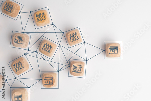 Business sale growth and expand shop franchise concept, Store illustration print screen on wooden cube block connection link with others shop and supermarket.
