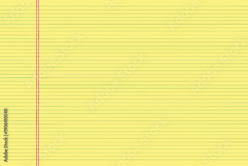 Close up of a yellow legal pad with lined paper and red edge