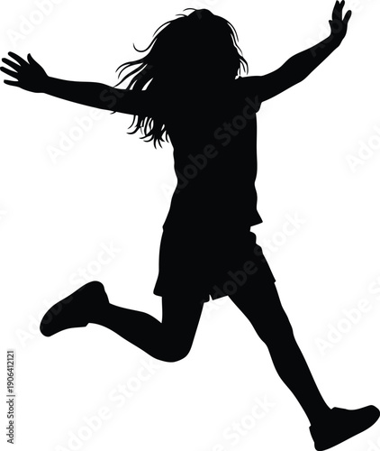 Silhouette of a happy girl jumping in the air with arms outstretched and long hair flowing