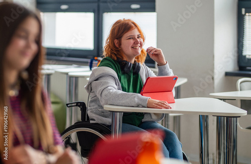 Fotografie Inclusive classroom scene with student using wheelchair.