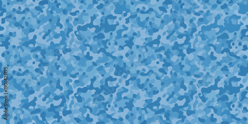 Abstract blue background with mottled texture and irregular shaped spots