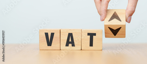 Foto hand change wooden block with VAT text to UP and Down arrow icon