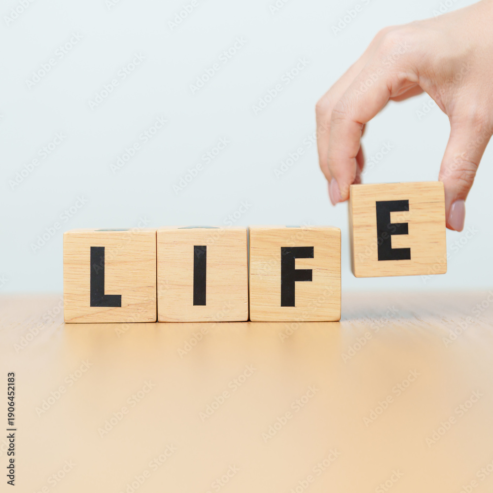 Naklejka premium hand change wooden block Live to Life. Lifestyle, Live your life, learning, motivation and mindset concepts