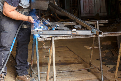 Repair work with welding in a workshop