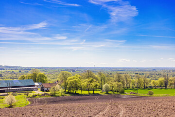 Papier peint photo Pantone 2025 Mocha Mousse Rural landscape view with a farm in the countryside a sunny spring day  © Lars Johansson
