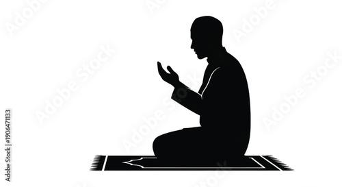 Man praying in silhouette on prayer mat in dark monochrome for religious or spiritual themes