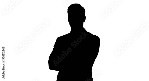 Silhouette of a person standing confidently with arms crossed